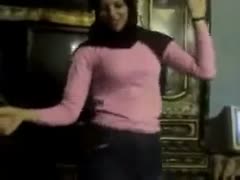 Pretty arab girl dances in front of a camera in homemade movie scene